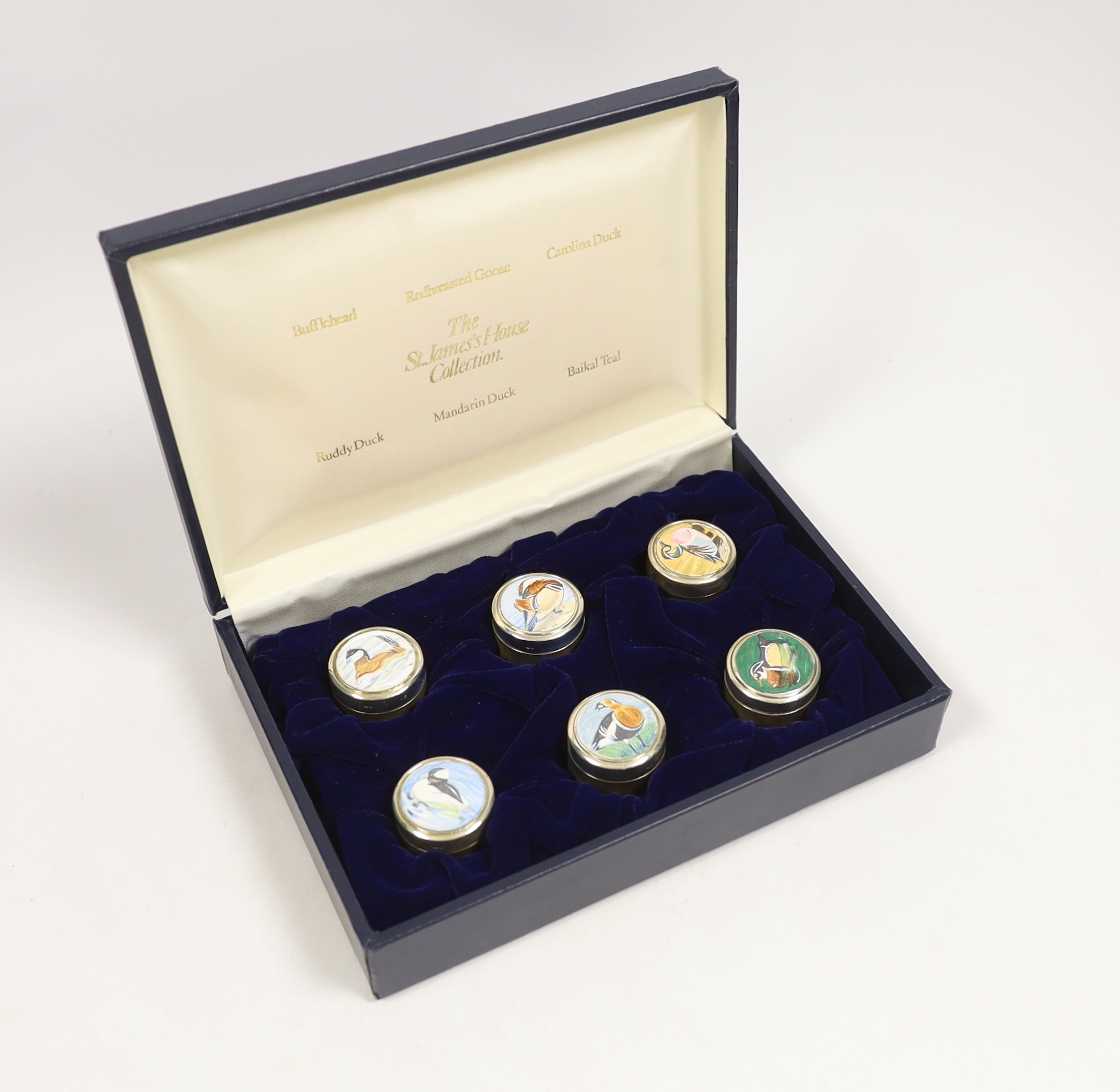 A cased set of six Elizabeth II St James's House Collection silver and enamel wild bird pill boxes, diameter 32mm, with certificate.